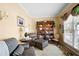 Cozy living room with comfortable seating, built-in bookcase, and ample natural light at 1810 Valley Brook Dr, Alpharetta, GA 30005