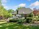 Backyard with deck, green lawn, and wooded perimeter providing privacy at 204 Overland Trl, Mcdonough, GA 30252
