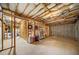 Unfinished basement is framed with wood and has exposed insulation, offering potential for customization at 204 Overland Trl, Mcdonough, GA 30252