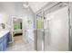Bathroom with a glass shower, soaking tub, and double sink vanity at 204 Overland Trl, Mcdonough, GA 30252