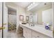 Bathroom featuring a vanity and a mirror, with access to a shower at 204 Overland Trl, Mcdonough, GA 30252