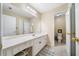 Bathroom featuring vanity, mirror, and neutral color palette with an adjoining toilet area at 204 Overland Trl, Mcdonough, GA 30252