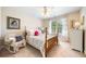 Comfortable bedroom with a soft color palette and a sun-drenched window at 204 Overland Trl, Mcdonough, GA 30252