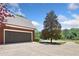 Spacious two-car garage with brick facade and extended driveway at 204 Overland Trl, Mcdonough, GA 30252