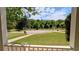 Scenic view from the porch overlooking the lush green neighborhood and cul-de-sac at 204 Overland Trl, Mcdonough, GA 30252