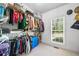 A large walk-in closet with ample hanging space and shelving at 204 Overland Trl, Mcdonough, GA 30252