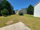 Backyard featuring an expansive lawn and mature landscaping at 2752 Live Oak Trl, Atlanta, GA 30349