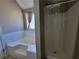 Bathroom featuring a bathtub and shower at 2752 Live Oak Trl, Atlanta, GA 30349