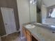 Bathroom featuring a mirror, sink, cabinets, shower, bathtub, and toilet at 2752 Live Oak Trl, Atlanta, GA 30349