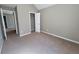 Neutral bedroom featuring closet and view to another room at 2752 Live Oak Trl, Atlanta, GA 30349