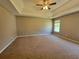 Bedroom with a window, ceiling fan, and carpeted floor at 2752 Live Oak Trl, Atlanta, GA 30349
