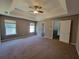 Bedroom featuring a ceiling fan and two windows at 2752 Live Oak Trl, Atlanta, GA 30349
