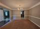 Cozy dining room with stylish chandelier and seamless access to the kitchen at 2752 Live Oak Trl, Atlanta, GA 30349