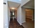 Inviting hallway with hardwood floors leading to various rooms within the home at 2752 Live Oak Trl, Atlanta, GA 30349