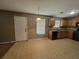 Well-lit kitchen featuring matching appliances, wood cabinets and light walls at 2752 Live Oak Trl, Atlanta, GA 30349