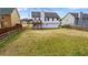 Expansive backyard featuring a raised deck and ample green space, perfect for outdoor activities and relaxation at 3094 Jonesboro St, Ellenwood, GA 30294