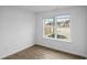 This bedroom offers lots of natural light from the large window and has wood-look flooring at 3094 Jonesboro St, Ellenwood, GA 30294