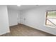 Bedroom featuring luxury vinyl plank flooring, neutral paint and ample closet space at 3094 Jonesboro St, Ellenwood, GA 30294
