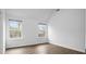 Spacious bedroom with high ceilings and natural light from two windows at 3094 Jonesboro St, Ellenwood, GA 30294