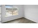 Well-lit bedroom featuring neutral-colored walls and a large window at 3094 Jonesboro St, Ellenwood, GA 30294