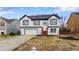 Inviting two-story home with a two-car garage, a well-manicured yard, and fresh, modern paint at 3094 Jonesboro St, Ellenwood, GA 30294