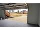 Large garage with epoxy floors leading to a home with well-maintained landscaping at 3094 Jonesboro St, Ellenwood, GA 30294