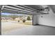 Spacious garage featuring an epoxy floor, insulated door, and an automatic door opener at 3094 Jonesboro St, Ellenwood, GA 30294