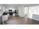 Modern kitchen features white cabinets, stainless steel appliances, and sleek black countertops at 3094 Jonesboro St, Ellenwood, GA 30294