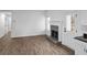 Inviting living room with a cozy fireplace, stylish flooring, and a bright, airy atmosphere at 3094 Jonesboro St, Ellenwood, GA 30294