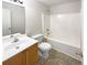 Neat bathroom with a sink, toilet, and tiled shower-tub at 6028 Arbor Links Rd, Lithonia, GA 30058