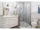 Modern bathroom featuring a glass-enclosed shower with gray subway tile and white vanity at 216 Haralson Ne Ln, Atlanta, GA 30307