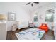 Cozy bedroom with natural light, decorative rug, and cheerful decor for a  at 216 Haralson Ne Ln, Atlanta, GA 30307