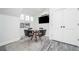 Cozy entertainment area featuring a TV, table with chairs, and stylish flooring at 216 Haralson Ne Ln, Atlanta, GA 30307