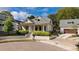 Charming home with manicured lawn and brick driveway showcasing classic architectural details at 216 Haralson Ne Ln, Atlanta, GA 30307