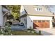 Charming exterior showing the deck, garage and the meticulously maintained landscaping at 216 Haralson Ne Ln, Atlanta, GA 30307