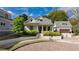 Charming home with landscaped front yard, welcoming porch, and detached garage providing great curb appeal at 216 Haralson Ne Ln, Atlanta, GA 30307