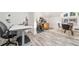 Home office with desk and gym equipment featuring light wood-look floors at 216 Haralson Ne Ln, Atlanta, GA 30307