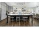 Open concept kitchen with a large island, modern appliances, and pendant lighting at 216 Haralson Ne Ln, Atlanta, GA 30307