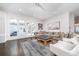 Spacious living room boasts hardwood floors, a large sectional sofa, and elegant decor at 216 Haralson Ne Ln, Atlanta, GA 30307