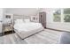 Serene bedroom with neutral colors, plush bedding, and ample natural light for ultimate relaxation at 216 Haralson Ne Ln, Atlanta, GA 30307