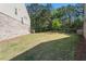 This spacious backyard features ample space for outdoor activities and relaxation, surrounded by natural greenery at 38 Trailview Ln, Hiram, GA 30141