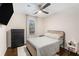 Well-lit bedroom features a ceiling fan and dresser with natural light through the window at 38 Trailview Ln, Hiram, GA 30141