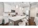 Well-lit kitchen features white cabinets, stainless steel appliances, and a stylish island with seating at 38 Trailview Ln, Hiram, GA 30141