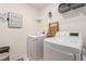 This laundry room is equipped with modern appliances, storage shelves, and ample counter space at 38 Trailview Ln, Hiram, GA 30141