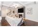 Stylish living room showcasing a fireplace, coffered ceilings, and seamless flow to the staircase at 38 Trailview Ln, Hiram, GA 30141