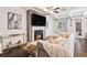 Elegant living room features a cozy fireplace, coffered ceilings, and modern decor at 38 Trailview Ln, Hiram, GA 30141