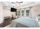 This bedroom offers a ceiling fan, and large windows with backyard views to create a tranquil and relaxing retreat at 38 Trailview Ln, Hiram, GA 30141