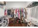 Organized walk-in closet featuring custom shelving, hanging racks, and ample storage space for clothing and accessories at 38 Trailview Ln, Hiram, GA 30141