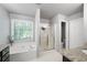 Bathroom with a garden tub, granite countertop and framed shower at 384 Wesley Dr, Acworth, GA 30101