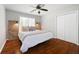 Cozy bedroom showcasing wood floors, a large window, barn door decor and double closet at 384 Wesley Dr, Acworth, GA 30101
